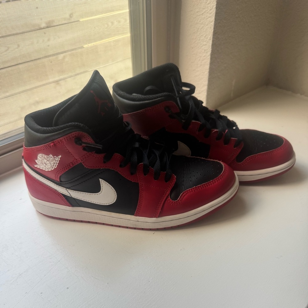 Nike Air Jordan 1 Black and Red Mid Top Sneakers